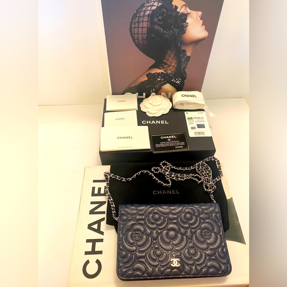 Chanel Camillia wallet on a chain. Blue with silver hardware.